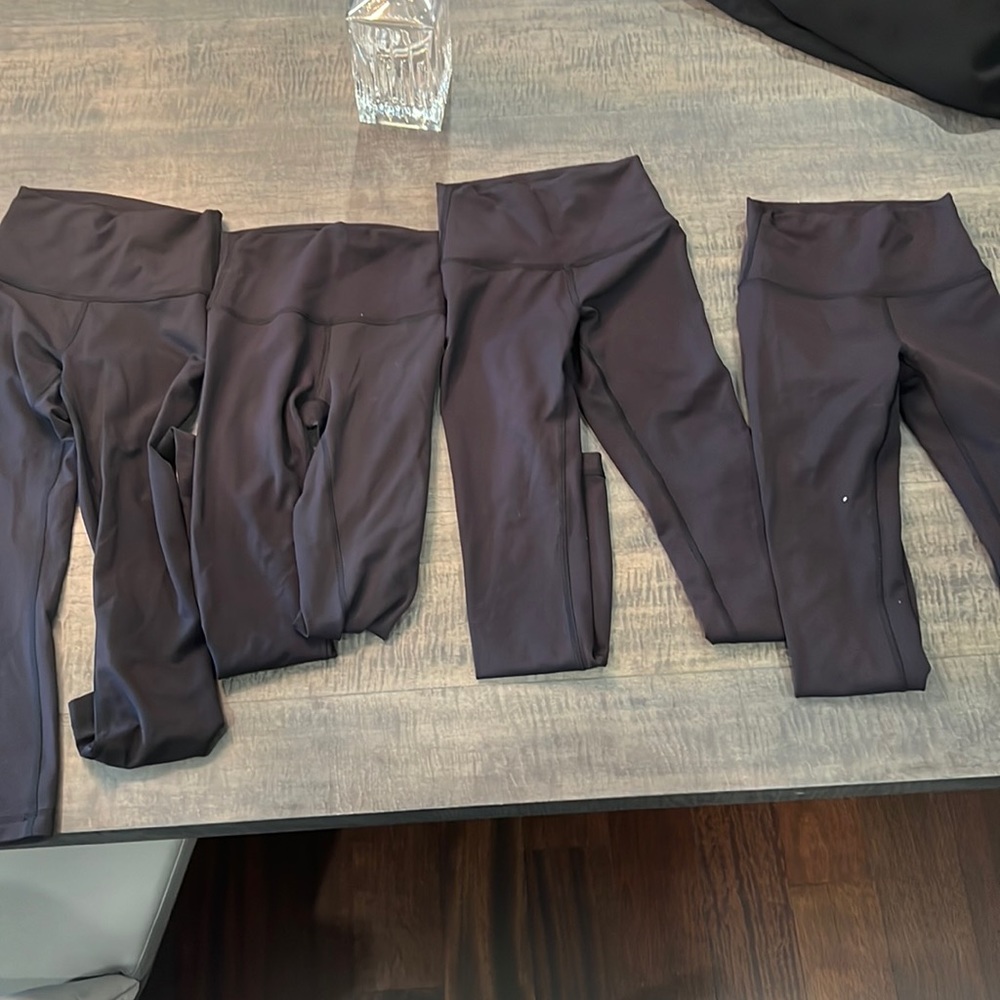 Four pairs of Lululemon black wonder trains 25 in size 2. All worn once.